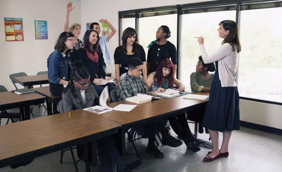 Teacher instructing a high school class.