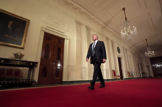 Image: President Donald Trump arrives to make an announcement at the White House
