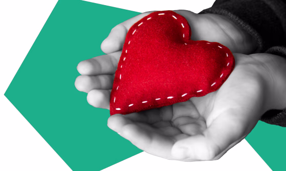 Image: Illustration of two hands holding a plush heart by NBC Photo Illustration