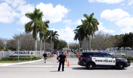 Image: Police vehicles are seen outside the David Posnack Jewish Day School after the second bomb threat in a month was reported in Davie, Florida, U.S. March 7, 2017. REUTERS/Andrew Innerarity