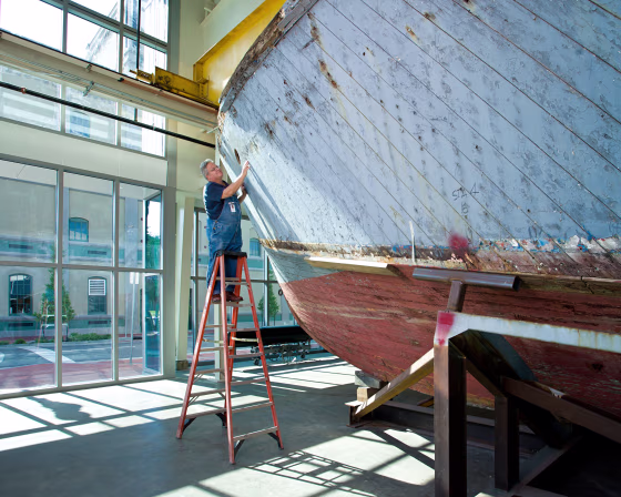 Image: Thomas Czekanski, the Museum's senior curator and restorations manager, with PT-305 shortly after her 2007 return to New Orleans.