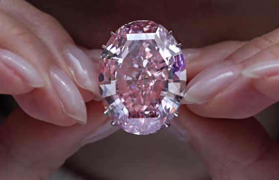 Image: A model displays the Pink Star diamond, the most valuable cut diamond ever offered at auction, at a Sotheby's auction room in Hong Kong, on March 29, 2017