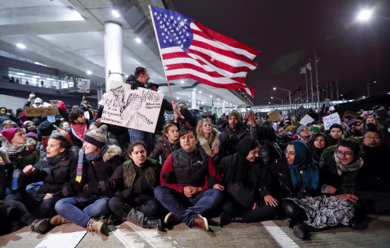 Image: People gather to protest against the travel ban imposed by U.S. President Donald Trump's executive order, at O'Hare airport
