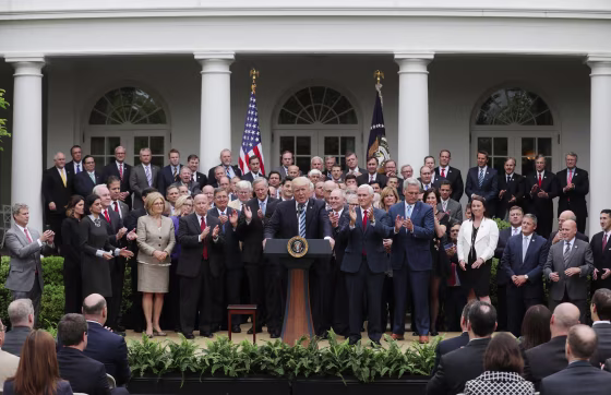 Image: Trump gathers with Republican House members after healthcare bill vote at the White House in Washington