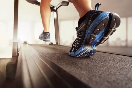Image: Man running in a gym on a treadmill concept for exercise