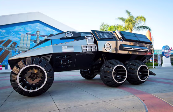 A sleek, black, concept Mars rover is displayed at the Kennedy Space Center in Cape Canaveral, Florida. The rover will tour the East Coast this summer for the center's "Summer of Mars" program.