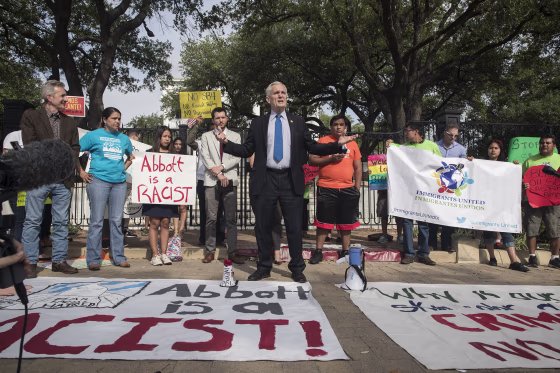 Image: Doggett speaks during a protest outside of the Texas Governor's Mansion in Austin