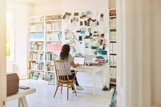 Image: A woman works at home