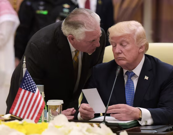 Image: President Donald Trump listens to U.S. Secretary of State Rex Tillerson during a meeting in Riyadh