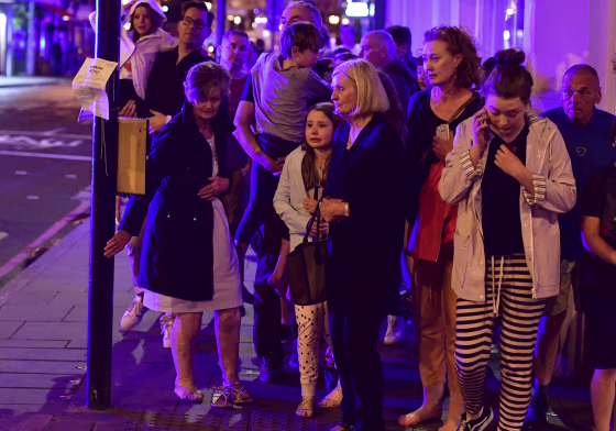 Image: People walking down Borough High Street as police are dealing with an incident on London Bridge in London, June 3, 2017. Witnesses reported a vehicle hitting pedestrians and injured people on the ground.