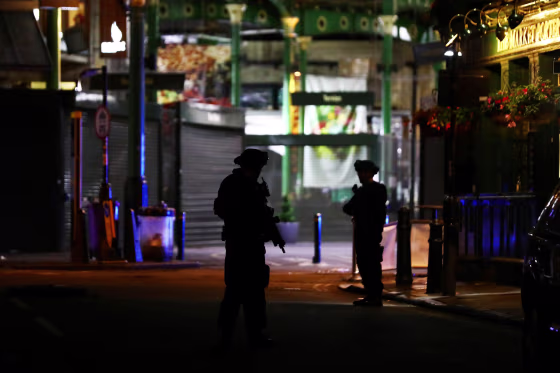 Image: Armed police patrol near Borough Market following an attack near London Bridge