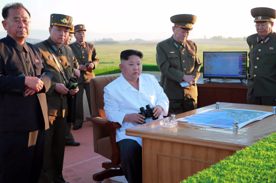 Image: North Korean leader Kim Jong Un watches the test of a new-type anti-aircraft guided weapon system organised by the Academy of National Defence Science