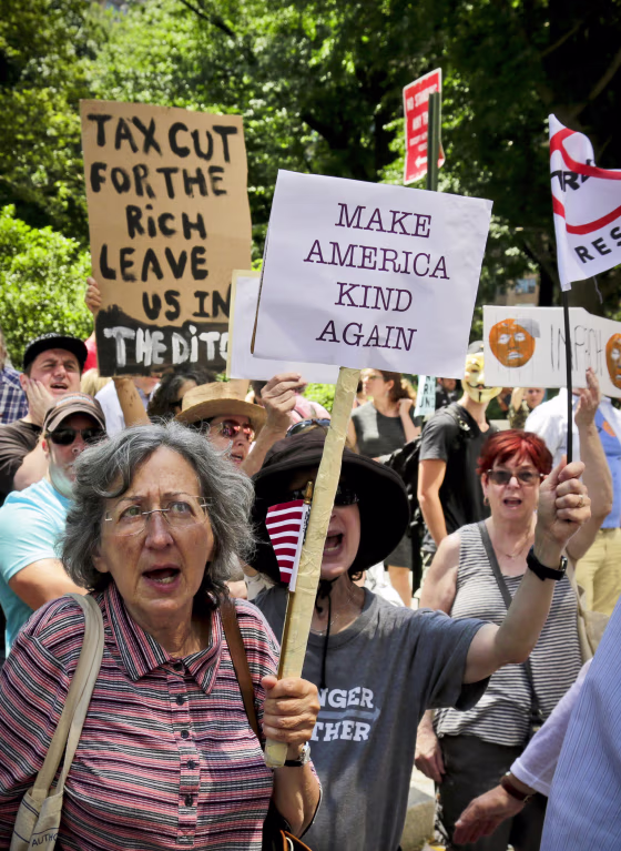 Image: Protesters rally outside a Trump hotel to call for the impeachment of President Trump