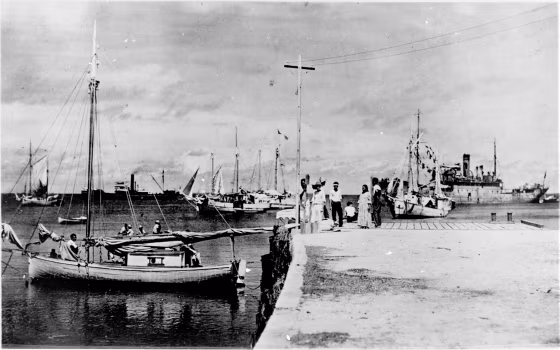 Image: A photo discovered in the National Archives shows a woman who resembles Amelia Earhart on a dock in the Marshall Islands