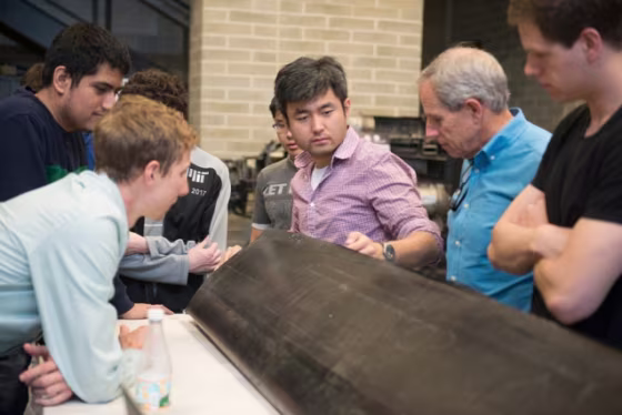 The team of engineers and their drone