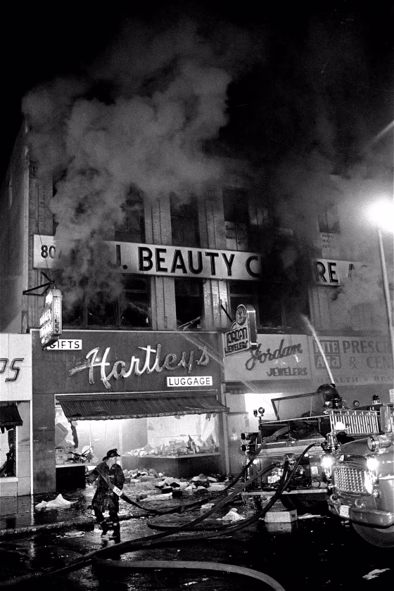 Image: Firemen spray water on burning buildings early July 14, 1967 on Broad Street in Newark, N.J