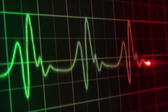 A close up of the digital screen of a heart monitor