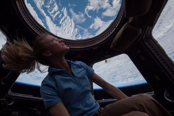 NASA astronaut Karen Nyberg enjoys the view of Earth from the windows in the Cupola of the International Space Station in 2013.