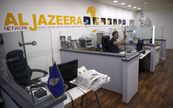Image: An employee of the Qatar based news network and TV channel Al-Jazeera is seen at the channel's Jerusalem office on July 31, 2017.