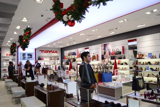 Employee working in the Puerto Rican shoe store Novus during the Holiday season in Pembroke Lakes Mall in Pembroke Pines, Florida.