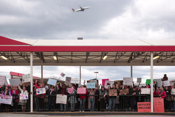 Image: Demonstrators yell slogans during anti-Donald Trump travel ban protests outside Hartsfield-Jackson Atlanta International Airport in Atlanta