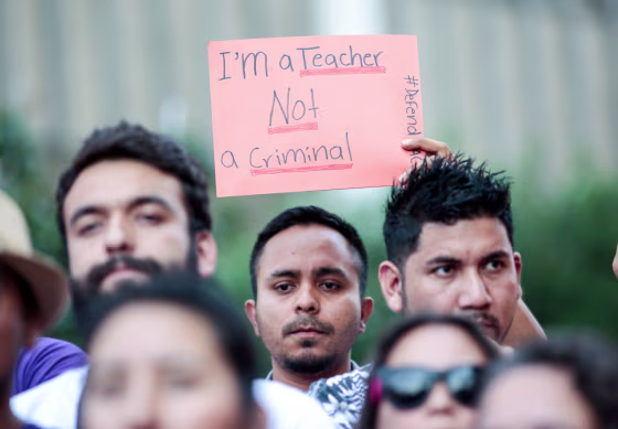 Image: Milton Flores, a Deferred Action for Childhood Arrivals (DACA) program recipient stands with supporters during a rally outside the Federal Building in Los Angeles