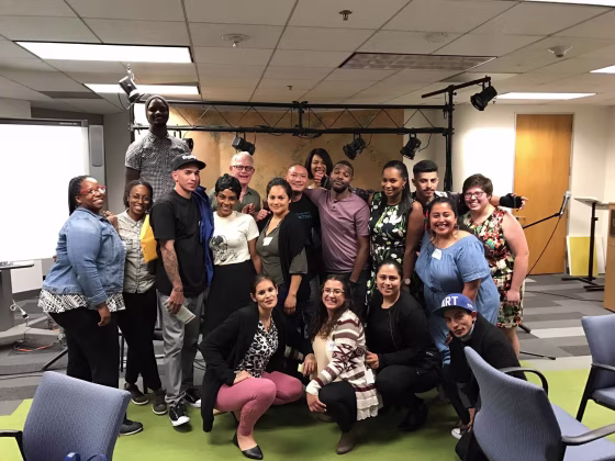 Jimmy Wu (center) with members of InsideOUT Writers, a nonprofit that uses creative writing to reduce the juvenile recidivism rate.