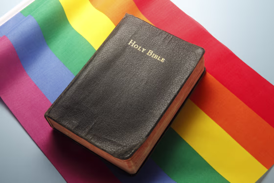 Bible On Top Of Rainbow Flag