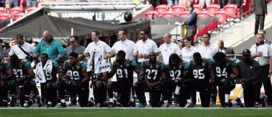 Jacksonville Jaguars players kneel during the national anthem as they prepared to play against the Baltimore Ravens at Wembley Stadium in London, England, on Sunday.