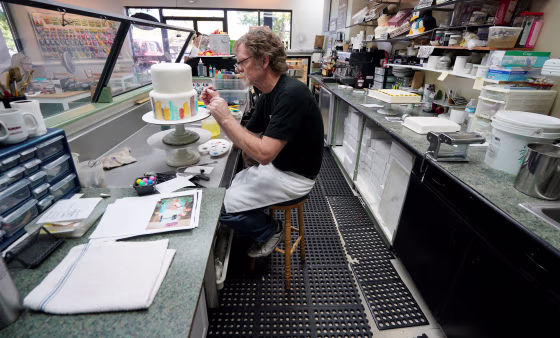 Image: Baker Jack Phillips decorates a cake in his Masterpiece Cakeshop in Lakewood, Colorado on Sept. 21, 2017.