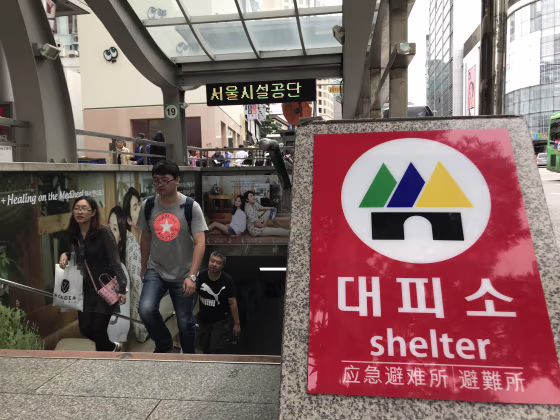 Image: South Koreans emerge from an underground shopping center