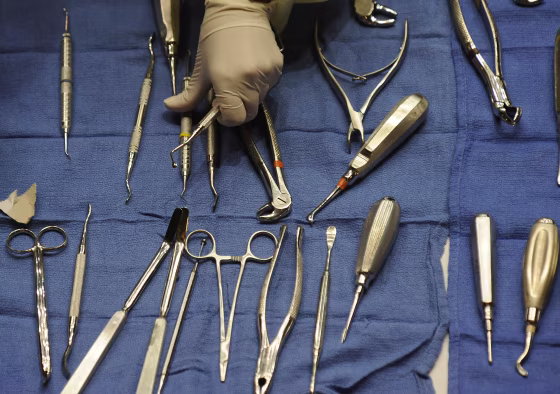 Image: A volunteers gets dental tools for dentists