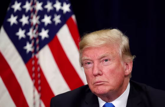 Image: President Donald Trump attends a briefing on hurricane recovery efforts in Dallas