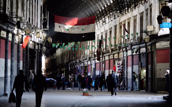 Image: Syrian vendors open their shops at the Hamidiya market