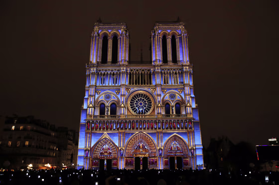 Image: The Notre Dame cathedral is illuminated during a light show called \"Dame de Coeur\"
