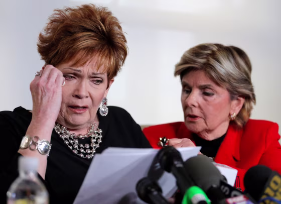 Image: Beverly Nelson wipes tears as she reads a statement to reporters with attorney Gloria Allred during a news conference announcing new allegations of sexual misconduct against Alabama Republican congressional candidate Roy Moore, in New York
