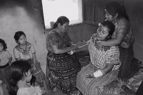 Image: Berta Navichoc, a healer and bonesetter, heals Marta Mendoza
