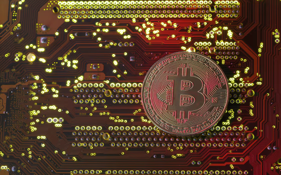 Image: A bitcoin illustration on a motherboard on Oct. 26, 2017.