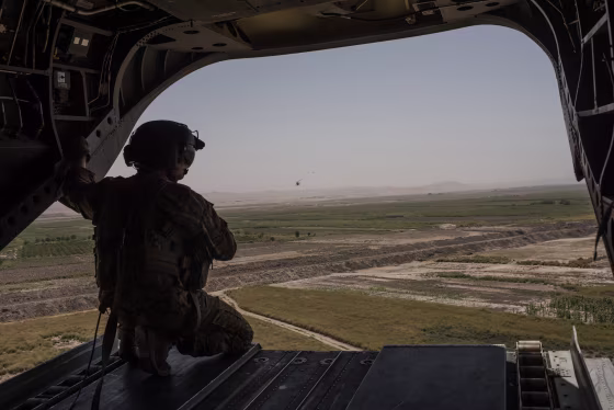 Image: A U.S. Army helicopter flies from Camp Shorab to Camp Bost