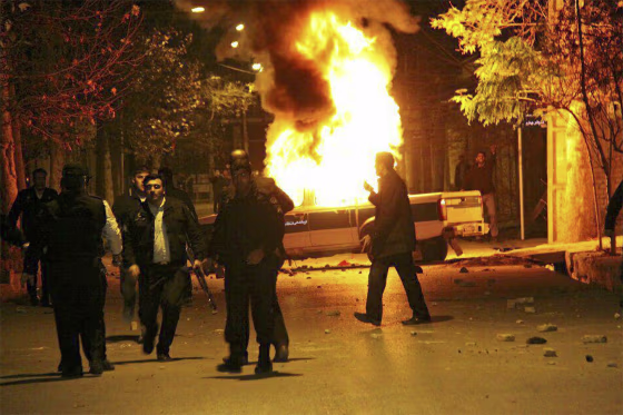 A vehicle burns as demonstrators protested high prices and the poor state of the economy in Dorud, in Iran's Lorestan province, on Dec. 30.