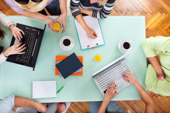 Image: Group of people with two laptops at a meeting