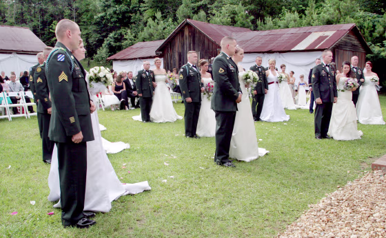 Image: Seventeen couples with the 3rd Heavy Brigade Combat Team, 3rd Infantry Division based at Fort Benning, Georgia, exchanged marriage vows at the Columbus Botanical Gardens in Columbus, Georgia on June 13, 2009.