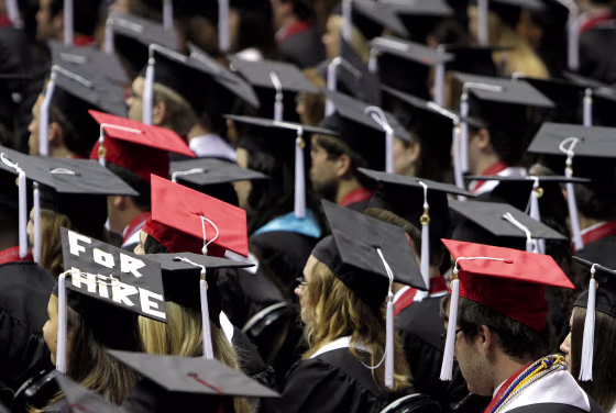 Image: Students attend graduation ceremonies at the University of Alabama in Tuscaloosa, Alabama on Aug. 6, 2011.