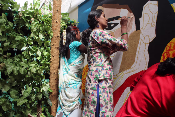 Meghala and Priyanka painting a mural in Bangalore, India, in March 2018.