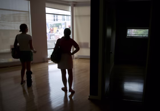 Image: Potential homebuyers look at a condominium for sale in Washington
