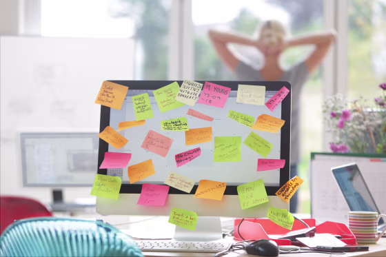 Image: A computer screen covered with notes
