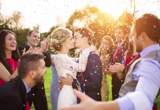 Image: newlywed couple and their friends