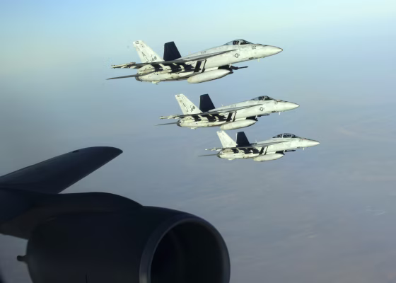 Image: A formation of U.S. Navy F-18E Super Hornets leaves after receiving fuel from a KC-135 Stratotanker over northern Iraq