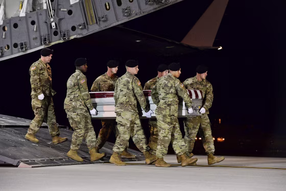 Image: A U.S. Army carry team transfers the remains of Army Staff Sgt. Dustin Wright at Dover Air Force Base in Delaware