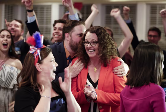 Image: Kara Eastman is hugged by her campaign manager